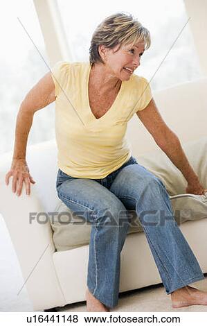 Stock Photo - Woman Suffering With Back Pain. Fotosearch