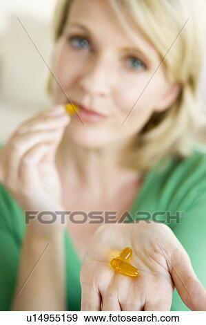 Woman Taking Pills View Large Photo Image Stock Photo - Woman Taking Pills. Fotosearch