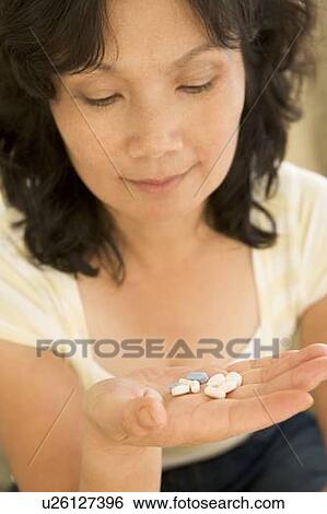 Woman Taking Pills View Large Photo Image Stock Photograph - Woman Taking Pills. Fotosearch