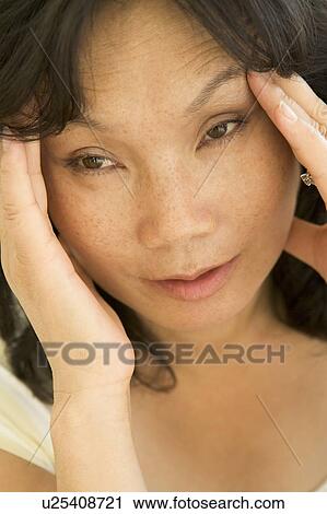 Stock Image - Woman With A Headache. Fotosearch