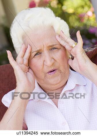 Stock Photography - Woman With A Headache. Fotosearch