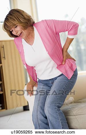 Woman With Back Pain View Large Photo Image Stock Photography - Woman With Back Pain. Fotosearch