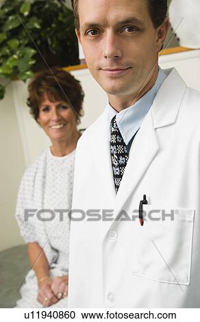 Stock Image - Doctor with patient. Fotosearch