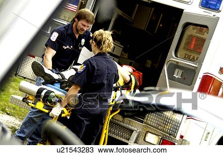 EMTs loading patient into ambulance View Large Photo Image Stock Image - EMTs loading patient into ambulance. Fotosearch