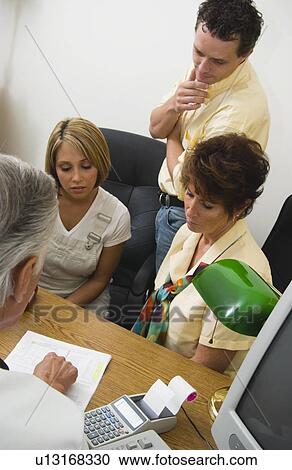 Stock Image - Family with doctor. Fotosearch