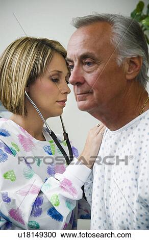Stock Image - Nurse and patient. Fotosearch
