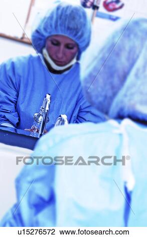 Nurse sanitizing hands before surgery View Large Photo Image Stock Image - Nurse sanitizing hands before surgery. Fotosearch