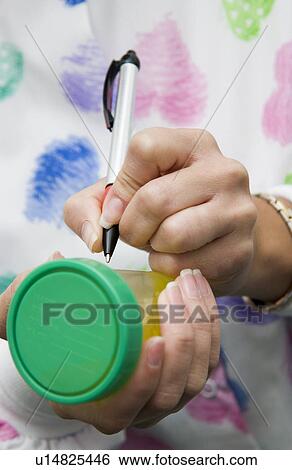 Nurse with urine specimen View Large Photo Image Stock Photograph - Nurse with urine specimen. Fotosearch
