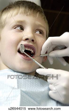 Stock Photography - Boy getting dental exam. Fotosearch
