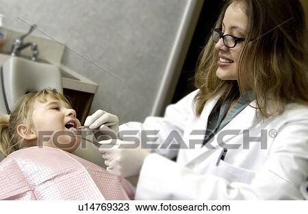 Girl getting dental exam View Large Photo Image Stock Image - Girl getting dental exam. Fotosearch