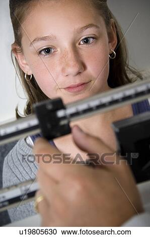 Girl on scale View Large Photo Image Stock Image - Girl on scale. Fotosearch