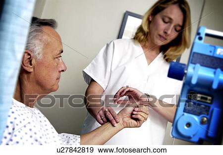 Nurse taking patient s pulse Nurse taking patient s pulse Nurse View Large Photo Image Stock Photo - Nurse taking patient s pulse Nurse taking patient s pulse Nurse . Fotosearch