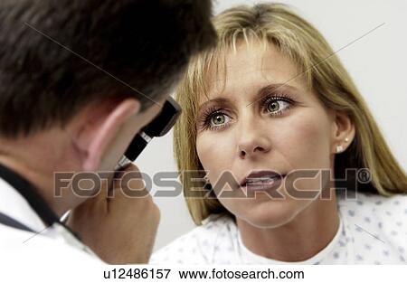 Physician examining patient View Large Photo Image Stock Photo - Physician examining patient. Fotosearch