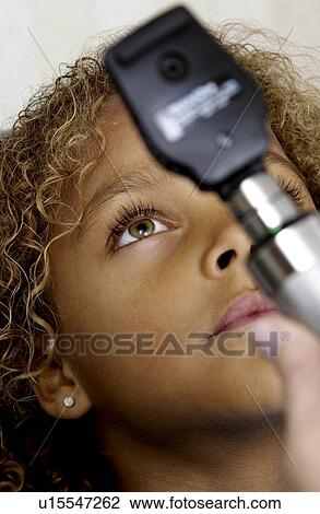 African American girl getting eye exam View Large Photo Image Stock Image - African American girl getting eye exam. Fotosearch