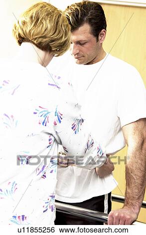 Stock Photograph - Man receiving physical therapy. Fotosearch