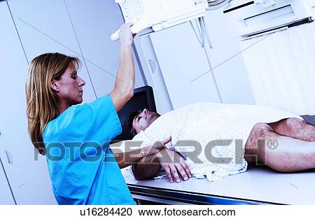 Patient having an xray taken View Large Photo Image Stock Image - Patient having an xray taken. Fotosearch
