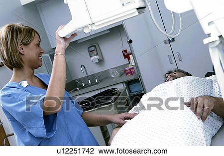 Stock Image - Xray tech taking xrays. Fotosearch