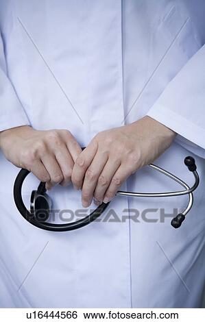Female doctor's hand holding stethoscope View Large Photo Image Stock Photograph - Female doctor's hand holding stethoscope. Fotosearch