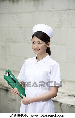 Stock Photograph - Portrait of a female nurse. Fotosearch