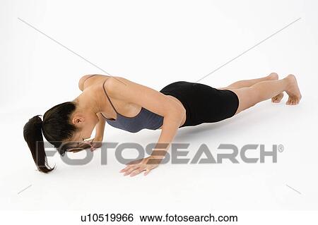 Stock Photograph - Woman doing push-ups. Fotosearch