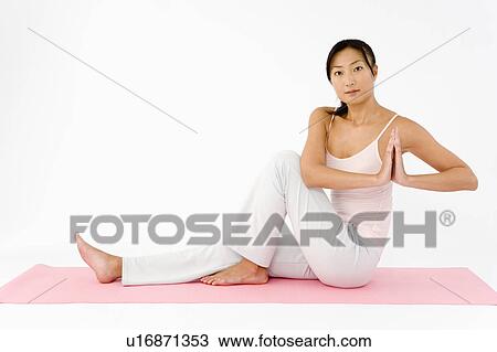 Woman doing yoga View Large Photo Image Stock Image - Woman doing yoga. Fotosearch