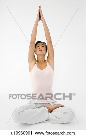 Stock Image - Woman doing yoga. Fotosearch