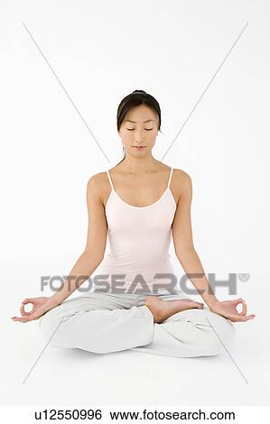 Stock Photograph - Woman doing yoga. Fotosearch