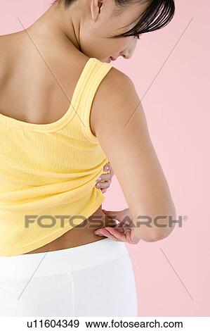 Woman pinching fat on side of waist View Large Photo Image Stock Photo - Woman pinching fat on side of waist. Fotosearch