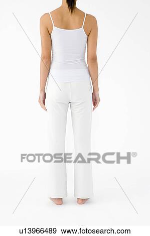 Woman standing, rear view View Large Photo Image Stock Photo - Woman standing, rear view. Fotosearch