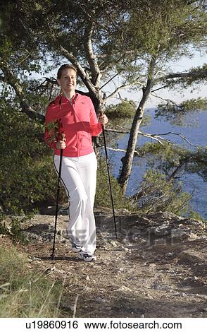 Stock Photograph - Female Nordic walker. Fotosearch