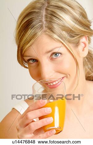 Portrait of Woman drinking juice View Large Photo Image Stock Photo - Portrait of Woman drinking juice. Fotosearch