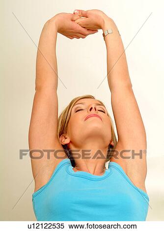 Woman stretching View Large Photo Image Stock Photography - Woman stretching. Fotosearch