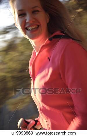 Stock Photo - Female Nordic walker, portrait. Fotosearch