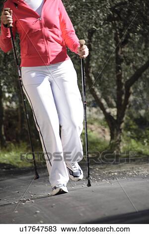 Female Nordic walker View Large Photo Image Stock Image - Female Nordic walker. Fotosearch