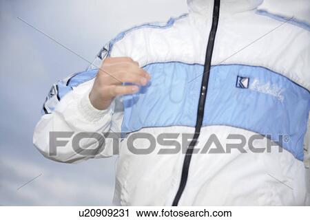 Jogger in sweat suit jacket, close up View Large Photo Image Stock Image - Jogger in sweat suit jacket, close up. Fotosearch
