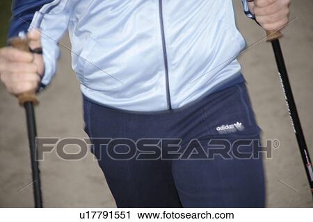 Male Nordic walker, close up of hands and pole straps View Large Photo Image Stock Image - Male Nordic walker, close up of hands and pole straps. Fotosearch