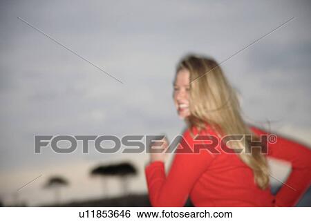 Upper part of woman's body jogging at the beach, side view View Large Photo Image Stock Photograph - Upper part of woman's body jogging at the beach, side view. Fotosearch