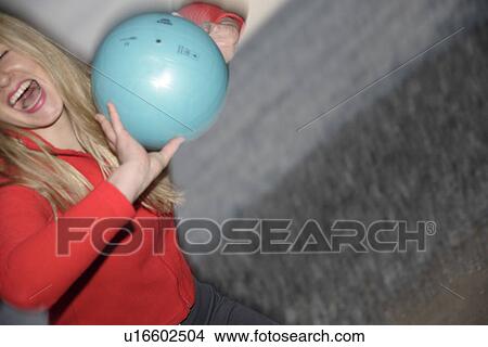 Young woman playing with a ball at the beach View Large Photo Image Picture - Young woman playing with a ball at the beach. Fotosearch