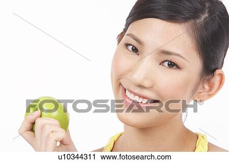 Portrait of Natural Young girl holding Apple View Large Photo Image Stock Image - Portrait of Natural Young girl holding Apple. Fotosearch