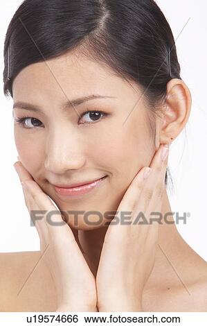 Portrait of Natural Young girl touching face View Large Photo Image Stock Photograph - Portrait of Natural Young girl touching face. Fotosearch