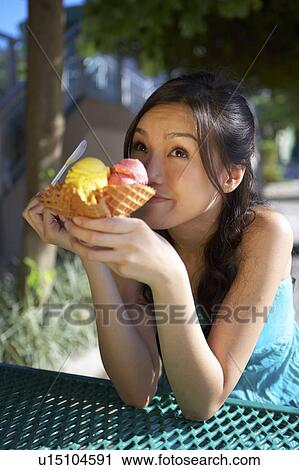 Young Lady Eating Ice-Cream View Large Photo Image Stock Image - Young Lady Eating Ice-Cream. Fotosearch