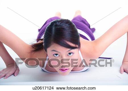 Young woman doing push-ups View Large Photo Image Picture - Young woman doing push-ups. Fotosearch