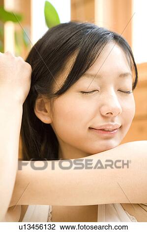 Woman stretching herself View Large Photo Image Stock Image - Woman stretching herself. Fotosearch