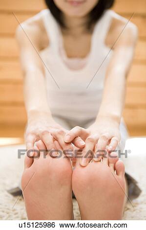 Woman stretching herself View Large Photo Image Stock Photograph - Woman stretching herself. Fotosearch