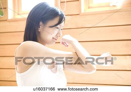 Woman stretching herself View Large Photo Image Stock Photograph - Woman stretching herself. Fotosearch