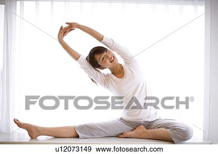 Woman who has gymnastic exercise in morning View Large Photo Image Stock Photo - Woman who has gymnastic exercise in morning. Fotosearch