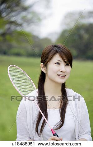 Stock Image - Woman who plays badminton. Fotosearch