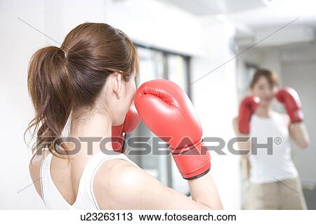 Woman who does a boxing-exercise View Large Photo Image Stock Image - Woman who does a boxing-exercise. Fotosearch