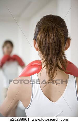 Woman who does a boxing-exercise View Large Photo Image Stock Image - Woman who does a boxing-exercise. Fotosearch