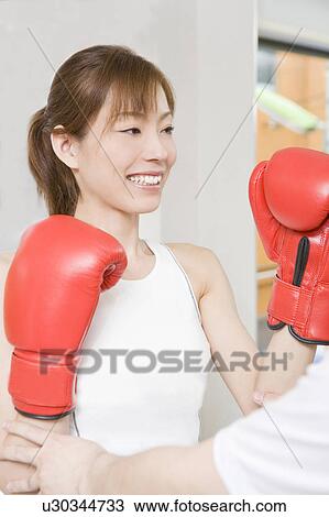 Woman who does a boxing-exercise View Large Photo Image Stock Image - Woman who does a boxing-exercise. Fotosearch